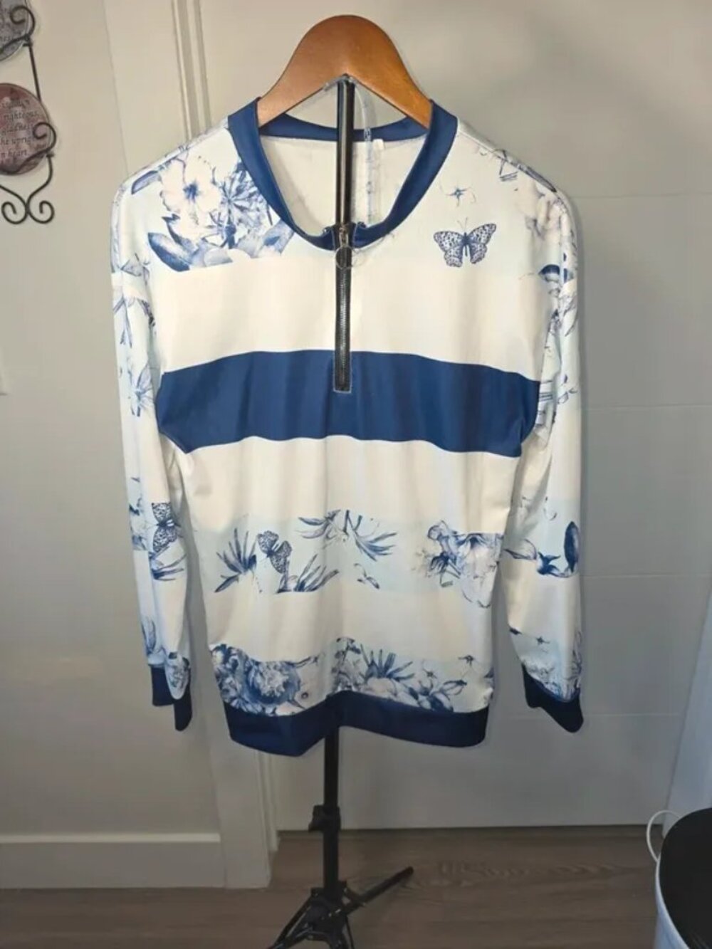 pullover sweatshirt, blue and white floral striped design with butterfly detail,